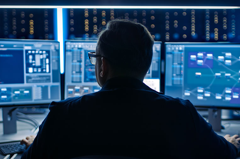 Man facing Security Operations Center screen